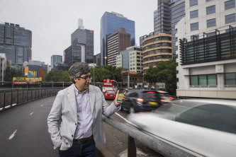 Dr Meead Saberi at the corner of King and Sussex streets near the Western Distributor. He measured the sound there at 85dB. Previous work showed it often peaked near 100dB.