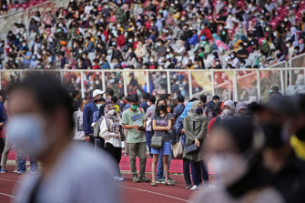 People line up to get vaccinated at the Gelora Bung Karno Main Stadium in Jakarta, Indonesia.