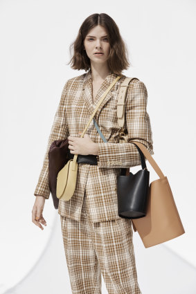 Oroton jacket, $599, and pants, $399; “Celia XL” clutch, $369; “Anouk” crossbody bag, $279; “Frida Mini” satchel, $399; small bucket bag, $299; 
large bucket bag, $429.