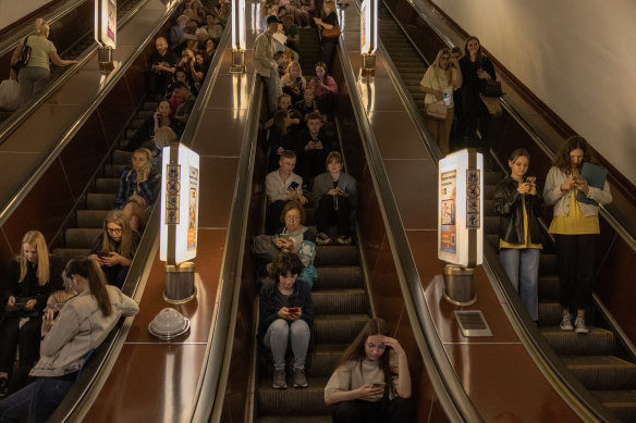 People shelter in a Kyiv subway station during Russian missiles attack on Monday.
