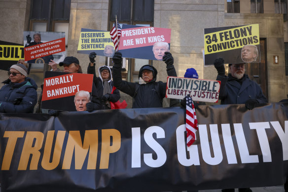 Protesters outside the Manhattan Criminal Court before the start of the sentencing.