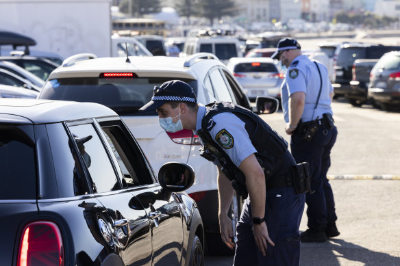 Police conduct public health order compliance checks at Bondi Beach on Sunday.