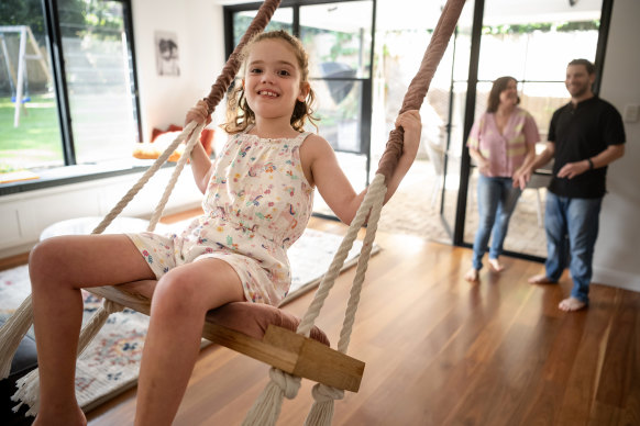 Sasha Lipworth on the swing her parents David and Nadine use to calm her down.