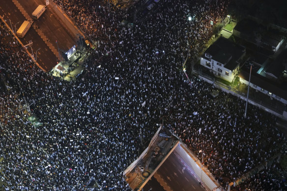 Tens of thousands of Israelis protest in Tel Aviv on Saturday against plans by Prime Minister Benjamin Netanyahu’s new government to overhaul the judicial system.