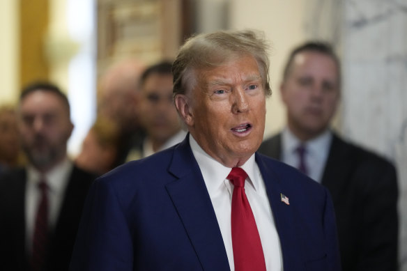 Former president Donald Trump speaks during a break in closing arguments  for his New York civil fraud trial.