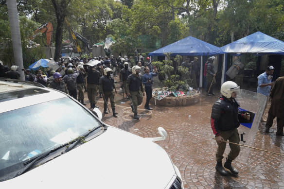 Police conduct a search operation in the residence of former prime minister Imran Khan, in Lahore on Saturday.