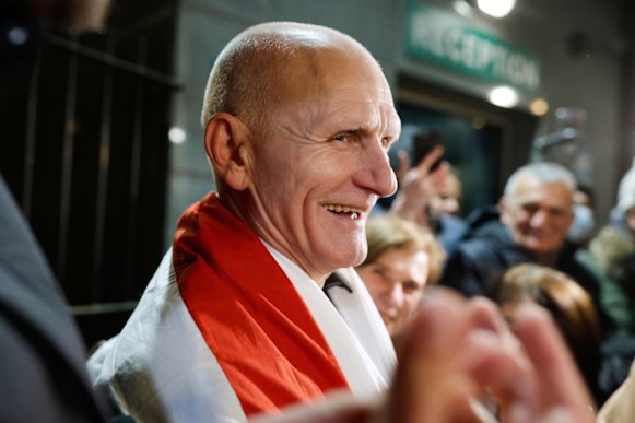 Nobel Peace Prize laureate Ales Bialiatski smiles as he arrives at the US embassy in Vilnius, Lithuania.