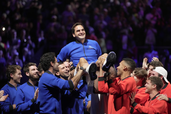 Team Europe’s Roger Federer is lifted by fellow players after playing the final game of his illustrious career.