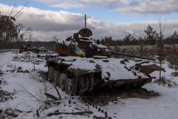A destroyed Russian tank with an artwork on it by Italian urban artist Tvboy, near the village of Dmytrivka, outside Kyiv, Ukraine. 