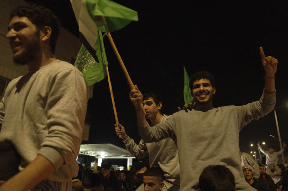 Palestinians released from Israeli prisons as part of the Israel-Hamas truce celebrate in Beitunia, West Bank.