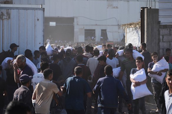Two people were killed in the crush, while two others died of gunshot wounds, hospital officials said.