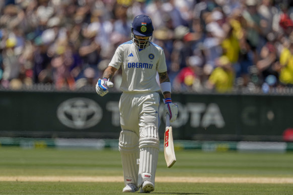 Virat Kohli departs the MCG on Monday, caught in the cordon again.