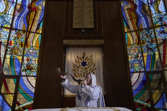 Rabbi Paul Lewin blows the shofar at the North Shore Synagogue in Lindfield.