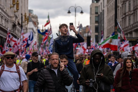 People take part in the “Unite the Kingdom” rally in London, England. 