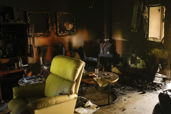 Destroyed furniture and charred walls are seen in a Kibbutz Nir Oz home that came under attack by Hamas on October 7.