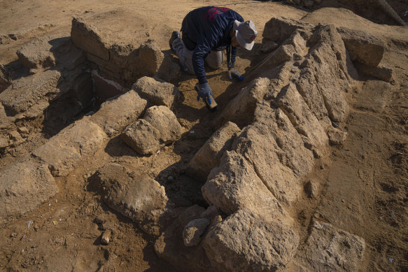 A member of a Palestinian excavation team works in a newly discovered Roman era cemetery in the Gaza Strip on december 11.