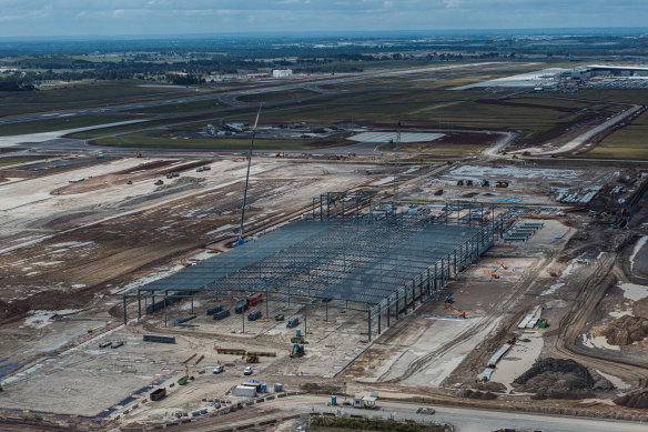 The first of five giant warehouses in the air cargo precinct. The runway and passenger terminal are in the background.