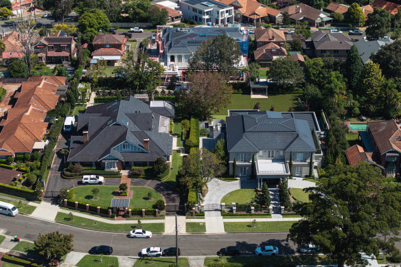 The Hales family mansions: On the left is the home of global leader Bruce Hales and his wife Jenny. On the right is the home of one of sons, Gareth Hales. At rear a new mansion takes shape: the home of another son, Charles Hales.