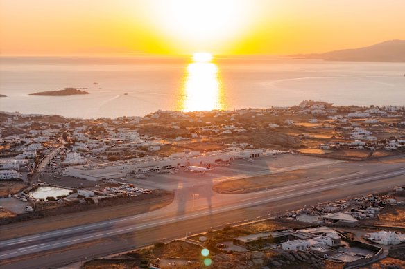 A sunset over the Cyclades at Mykonos Airport.