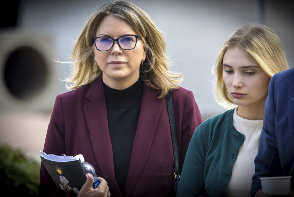 Rebecca Grossman, left, and daughter head to the courthouse in the Van Nuys section of Los Angeles in February.