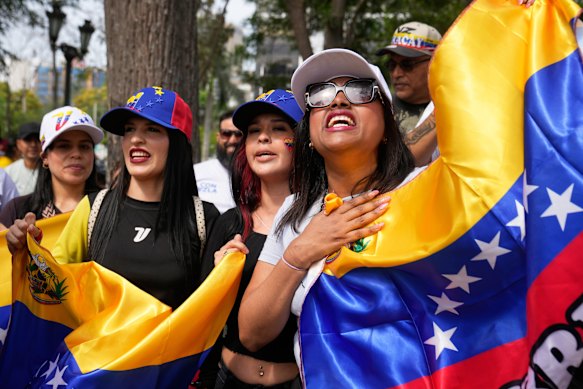 Venezuelans in Peru celebrate the capture of Nicolas Maduro.