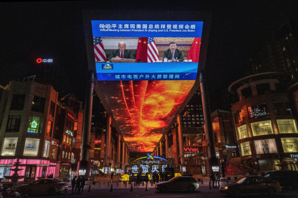 A large screen in Beijing shows talks between Xi Jinping and Joe Biden in November.  