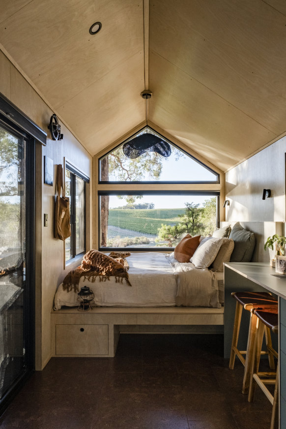 Inside is a super comfy bed on a platform by a big picture window.