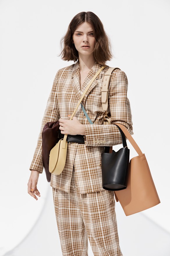 Oroton jacket, $599, and pants, $399; “Celia XL” clutch, $369; “Anouk” crossbody bag, $279; “Frida Mini” satchel, $399; small bucket bag, $299; 
large bucket bag, $429.