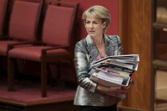 Jobs and Innovation Minister Michaelia Cash walks out of the Senate.