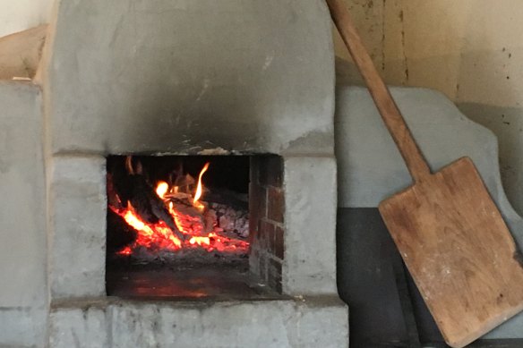 Wood-fired oven used to bake bread and pizza in the  afterheat in the Ben Hall  Cottage at the rear of The  Sir  George in Jugiong.