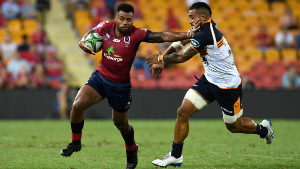 Samu Kerevi of the Reds (left) fends off Lolo Fakaosilea during the Round 3 Super Rugby win over the Brumbies.
