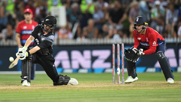 Cleaning up: Colin Munro sweeps to the boundary. 