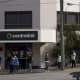 People queue outside Centrelink at the beginning