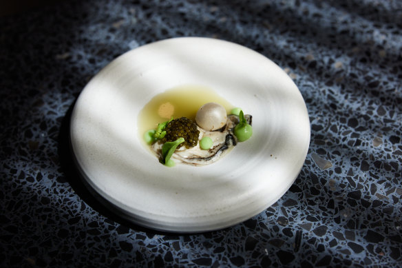 “Oyster and pearls”: A Tasmanian oyster with apple horseradish coulis, a pearl made of horseradish mousse, apple slice, and 1g of Ossetra caviar. 
