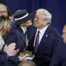 President-elect Donald Trump greets Melania Trump at his inauguration in the US Capitol Rotunda in Washington, DC. 