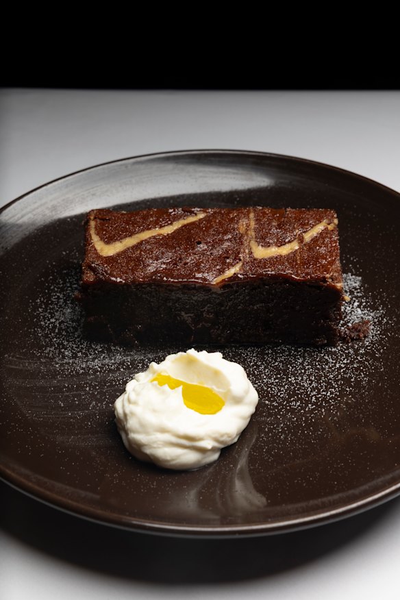 Chocolate and tahini brownie with hung yoghurt and olive oil.