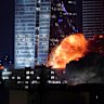 An explosion rises during a missile attack on Tel Aviv on Friday night after Iran launched a retaliatory missile strike against Israel.