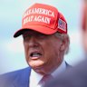 US President Donald Trump speaks with reporters upon arriving in New Jersey on Friday.
