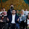 Greens Senator Jordon Steele-John alongside NDIS advocates during a post budget press conference at Parliament House.
