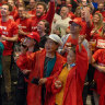 ALP supporters cheer after the ABC projected a Labor election win on November 26.