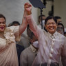Philippines President Ferdinand Marcos jnr poses with new Vice President Sara Duterte after his swearing-in ceremony.