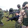 Russian Army recruits hold their weapons during a military training at a firing range in Donetsk on October 4.
