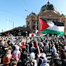Protesters gathered in their thousands at Flinders Street Station on Thursday night.