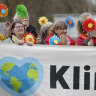 People demonstrate outside the European Court on Wednesday, when a group of Swiss retirees took their government to the top European court for failing to take stronger action on climate change. 