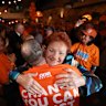 Pauline Hanson embraces a supporter at the One Nation HQ party in Albury.