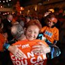 Pauline Hanson embraces a supporter at the One Nation HQ party in Albury on Saturday.