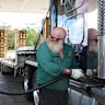 Truck driver Chris Gibbs fills the tank.  Australia’s dependency on diesel has become a major problem in the Iran fuel crisis.