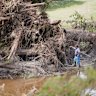 People search along the Guadalupe River after flooding in Kerrville, Texas on Wednesday.