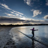 Anne Young, 73, ignores the frigid weather for an invigorating dip at Williamstown.