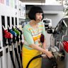 Amy Mok fills her car at a Strathfield service station on Monday.